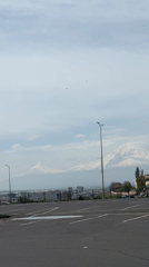 Morning scenes documented across Yerevan showing construction, parking lots