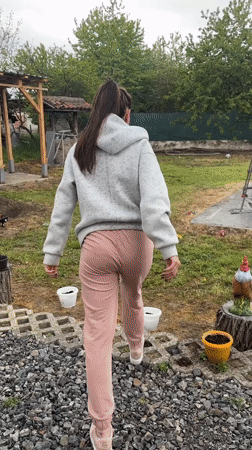 Woman runs toward backyard pool in Bulgarian village