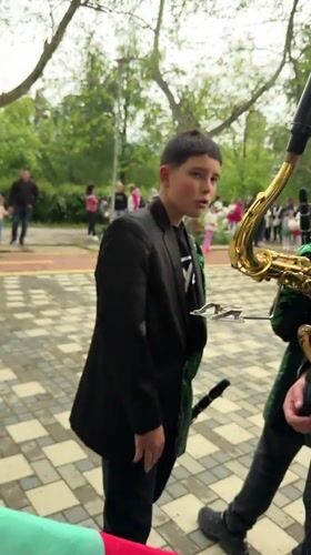 Youth band parades with Bulgarian flags in Varshets