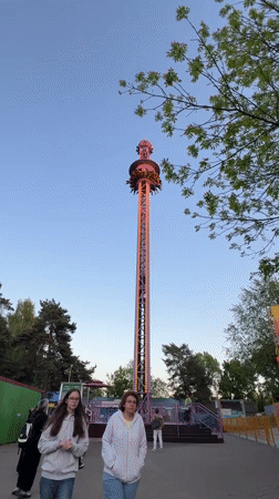 Amusement park visitors enjoy rides in Minsk, Belarus