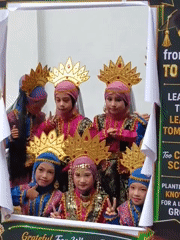Girls celebrate graduation in traditional costumes in Lhokseumawe