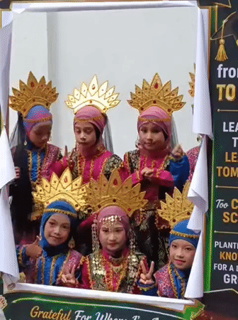 Girls celebrate graduation in traditional costumes in Lhokseumawe