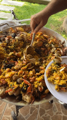 Seafood paella dinner served at outdoor gathering in Mexico