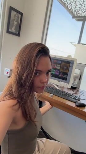 Woman works with laser engraver in Mexico workspace
