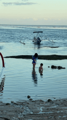 Morning beach activities captured along tropical Indonesian coastline