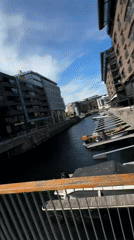 Sunny day at Oslo harbor with boats and castle