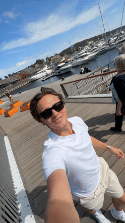 Sunny day at Oslo harbor with boats and castle