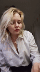 Woman enjoys evening meal at Izhevsk apartment overlooking street
