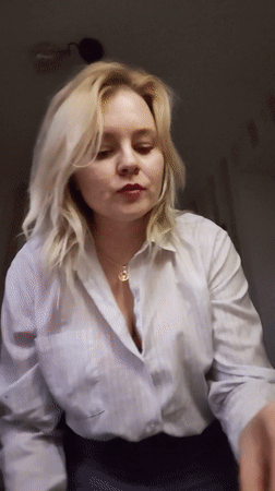 Woman enjoys evening meal at Izhevsk apartment overlooking street