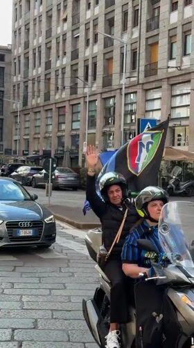 Everyday street scene documented in Milan's cobblestone district