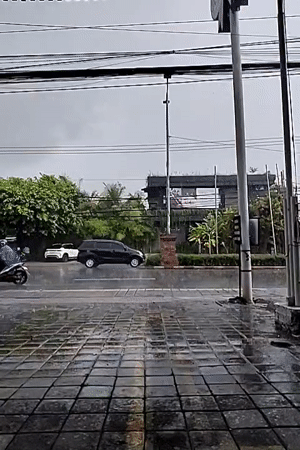 Rainy street scene captured in Kuta Selatan, Indonesia