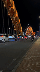 Da Nang's Dragon Bridge glowing on a July night