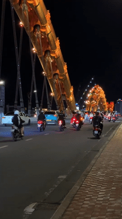 Da Nang's Dragon Bridge glowing on a July night