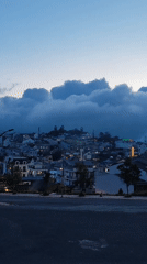 Dawn fog blankets Da Lat cityscape in Vietnam