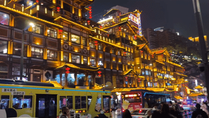 Tourists gather at illuminated Hongyadong district in Chongqing evening