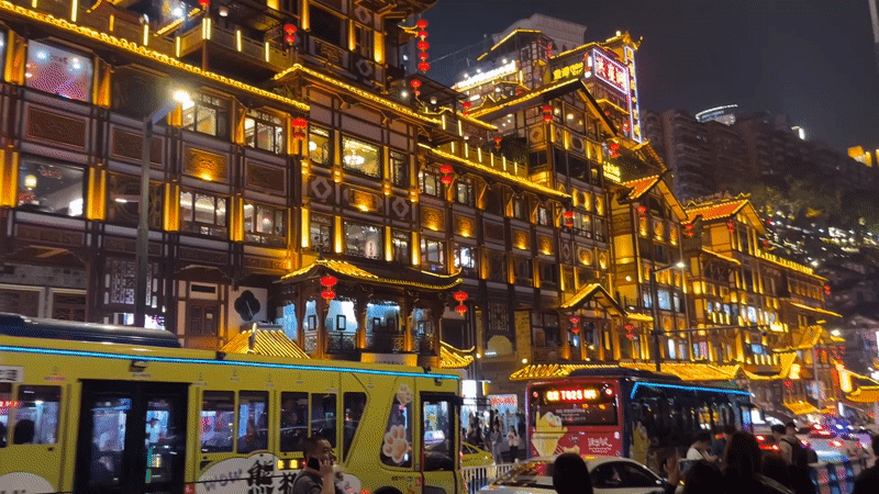Tourists gather at illuminated Hongyadong district in Chongqing evening
