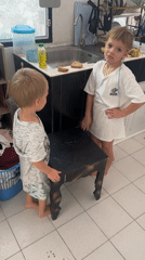 Children and pillow moments captured in Koh Phangan kitchen