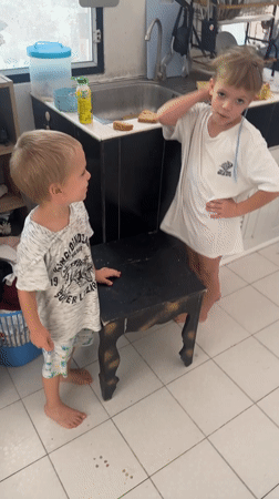 Children and pillow moments captured in Koh Phangan kitchen