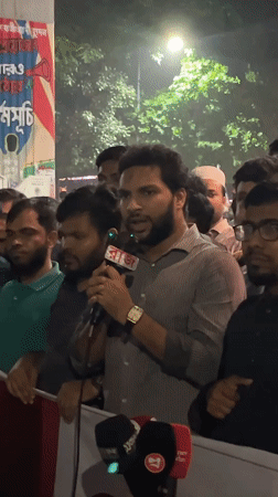 Nighttime rally draws crowd around illuminated monument in Dhaka