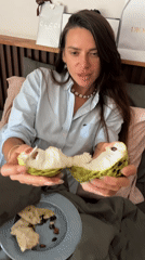 Woman enjoys early morning breakfast in Ban Bang Rak