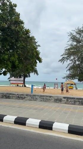 Late night beach volleyball and cycling activity in Karon