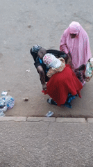 Street market humming with vendors and foot traffic at dusk