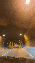 Vehicle drives through illuminated tunnel in Sochi, Russia