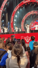 Moscow outdoor performance features traditional Russian singer and dancers