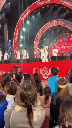 Moscow outdoor performance features traditional Russian singer and dancers