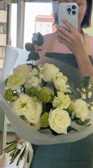 Woman documents morning routine with flowers and breakfast in Izhevsk