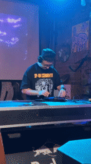 SP-404 operator adjusts gear at a Moscow electronic music setup