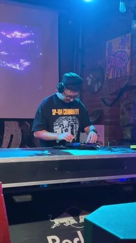 SP-404 operator adjusts gear at a Moscow electronic music setup