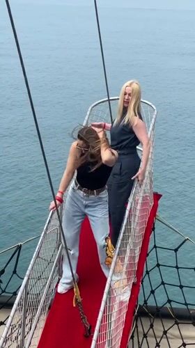 Two women spotted on elevated platform over blue waters in Turkey