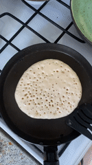 Morning pancake cooking captured in Rusanovo kitchen