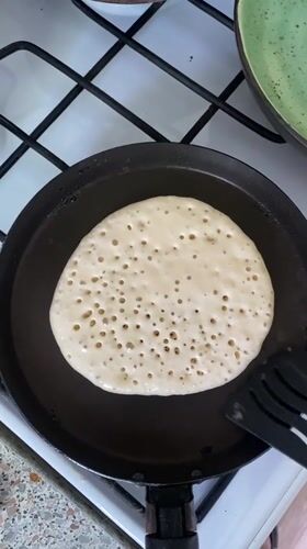 Morning pancake cooking captured in Rusanovo kitchen