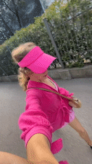 Woman in pink filmed touring coastal Boreti, Montenegro