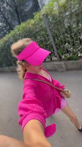 Woman in pink filmed touring coastal Boreti, Montenegro