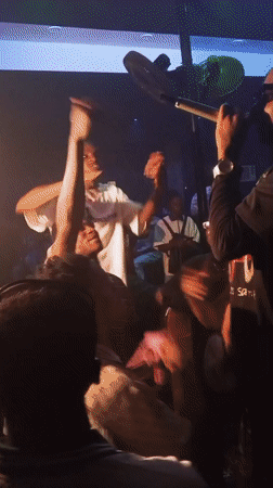 Nightclub performance with rapper and drums captured in Lokoja