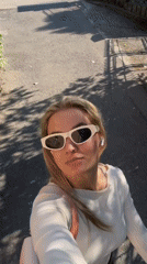 Woman films selfie videos while walking through Budva Montenegro