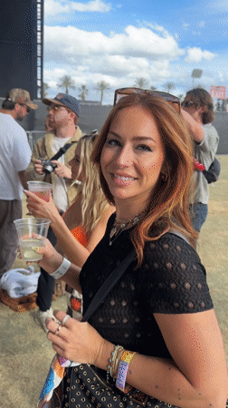 Woman takes mirror selfie at outdoor La Quinta event