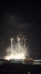 Fireworks display over Pavlodar under a full moon