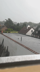 Contrasting scenes captured in Nivelles: rainy rooftops, dramatic encounter