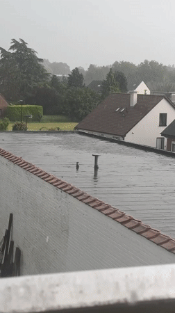 Contrasting scenes captured in Nivelles: rainy rooftops, dramatic encounter