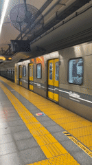 Buenos Aires subway train arrives at platform during morning hours