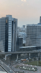 Woman films herself in Bangkok high-rise overlooking city skyline