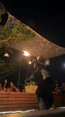 Fire dancers perform nighttime show in Ban Haad Rin Thailand
