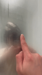 Person draws smiley face on fogged glass in Lyon