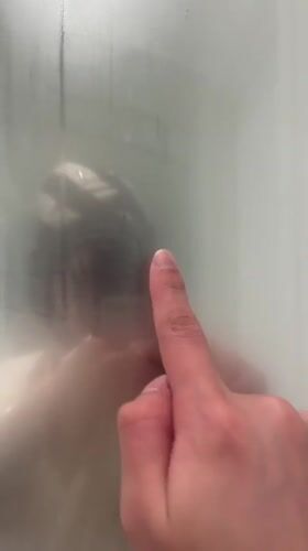 Person draws smiley face on fogged glass in Lyon