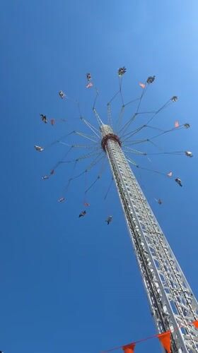 Tall swing ride operates under clear skies in The Hague