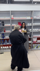 Everyday moments documented across Chaikovsky include commerce and family